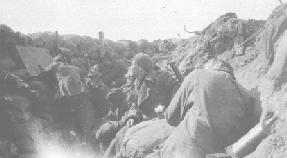 The Commanding Officer fires a rifle grenade - the Liverpool Scottish in the Front Line (almost certainly Trench 38 at Hill 60 in March 1915) - note periscope and loop hole.