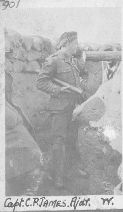 Click to learn more: Captain CP James, adjutant of the Liverpool Scottish in a trench in the Ypres Salient Sprig 1915, periscope under his arm. 