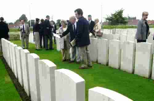 Major Roy Boardman and Mr and Mrs Boardman look at the graves at Brandhoek New Military Cemetery, 29/07/00 Crown Copyright