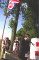 Crown Copyright. Major Ian Riley greets the guests of The Liverpool Scottish and their UK and Belgian friends. 29/07/00